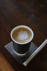 Coffee latte close up on rustic wood table