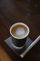 Coffee latte close up on rustic wood table