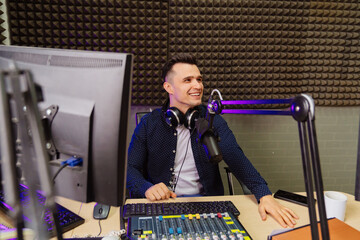 cheery radio in a shirt host broadcasts live reads news on computer screen.