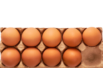 Nine eggs on a cardboard stand on a white insulated background