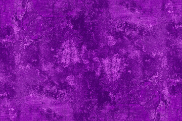 Damaged old concrete wall surface with purple paint for texture background