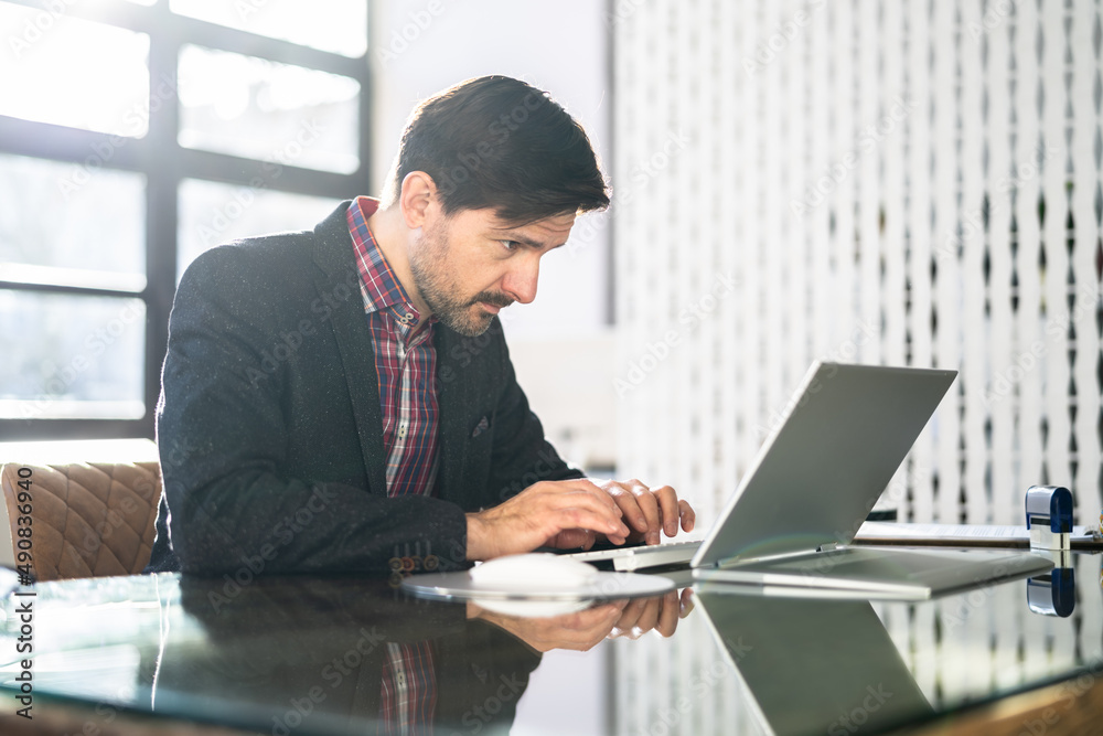 Poster Man Sitting In Bad Posture Working On Computer