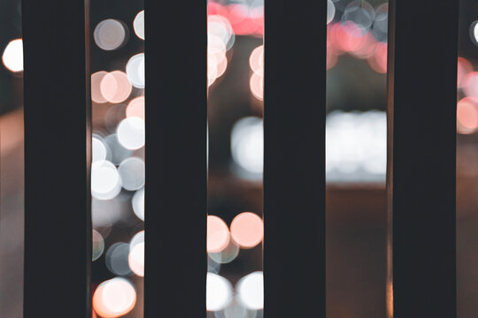 Bokeh light seen through wooden fence in Bucheon city, South Korea