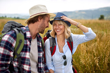 Loving embracing couple having fun in the nature..Holidays, vacation and friendship concept.