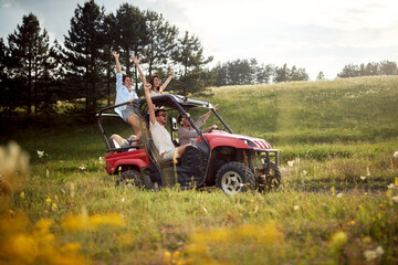 group of young friend driving a off road buggy car