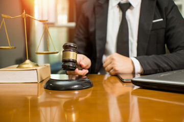 judge on wooden table And experienced lawyers meet with clients and give advice behind the scenes. legal services legal consulting concept