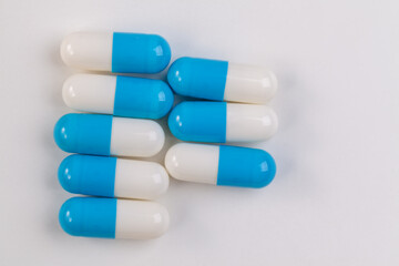 Colorful pill capsule on white background.