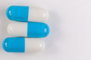 Colorful pill capsule on white background.