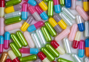 Colorful pill capsule on white background.