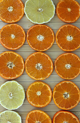 flat image of sliced tangerines and lemons