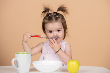 Babies eating, healthy food for a baby. Kid girl eating healthy food.