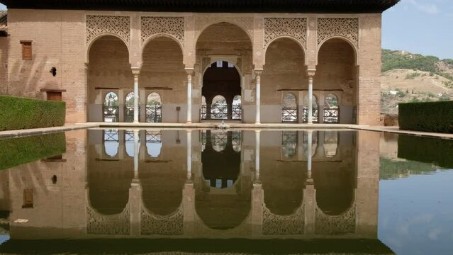 Garden of the Partal,  Alhambra Granada. Reflection in the water. Moorish Architecture. Unesco Unesco World Heritage Spain. Travel in time and discover history. Amazing destinations for holidays. 
