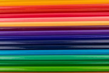 Many multicolored pencils, isolated on white background with copy space. Art and education background.