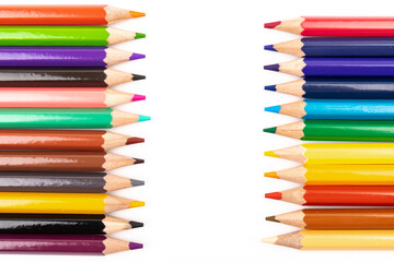 Many multicolored pencils, isolated on white background with copy space. Art and education background.
