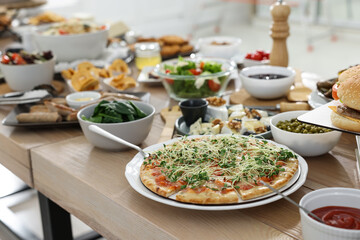 Brunch table setting with different delicious food indoors