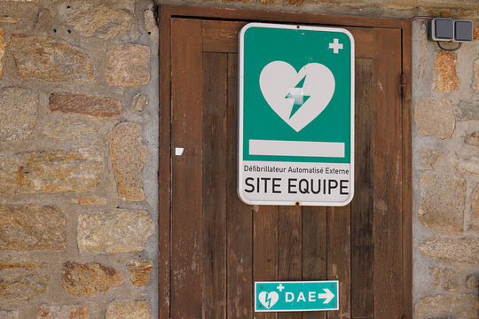 DAE defibrillateur automatise externe logo brand and text sign label station of an automated external defibrillator in french town
