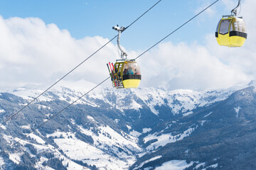 Fototapeta na wymiar Cable car in a skiing resort in Europe during winter holiday