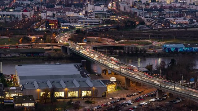 Timelapse of traffic at dusk crossing river Seine in Rouen, France