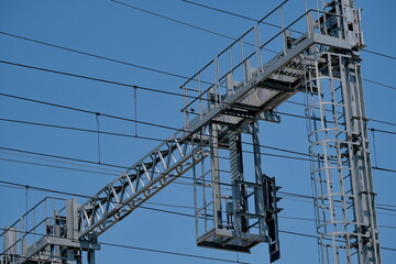 Overhead power lines against blue sky