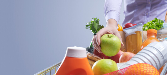 Woman doing grocery shopping at the hypermarket