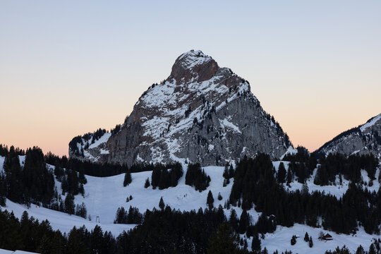 Amazing morning view and an epic sunrise with pink and blue tones. Epic long exposure shot in the heart of Switzerland. Wonderful scenery with the mountain called Grosser Mythen in the background.