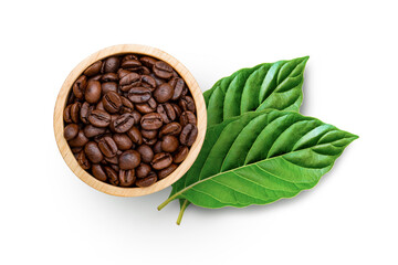 Roasted coffee beans in wooden bowl with green leaf isolated on white background. Top view. Flat...