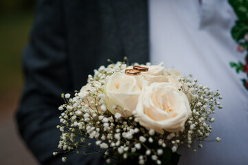 Bouquet of flowers in the groom's hand