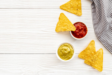 Snack for party corn nachos with salsa and guacamole sauces