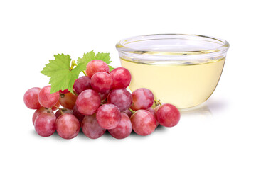 Grapes seed oil in glass bowl isolated on white background. 