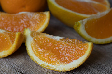 half fresh orange on wooden background