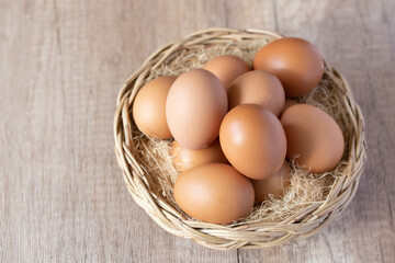 fresh chicken eggs in a wicker basket