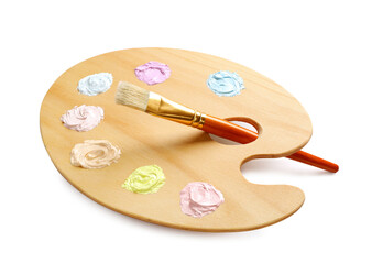 Wooden artist's palette with samples of pastel paints and brush on white background