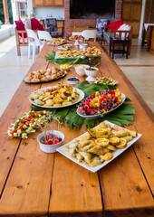 snack table with fruit salads and pastries