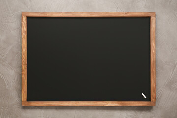 Clean blackboard with piece of chalk on grey background, top view © New Africa