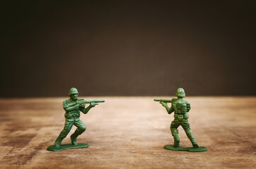 image of toy soldiers over wooden table