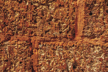 The old wall is made of red bricks.Texture of a wall made of antique bricks.Vintage red brick wall.