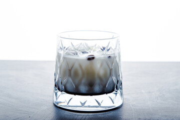 Closeup detail view of White Russian Alcoholic cocktail with copy space.