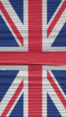 Fragment of British flag on a dry wooden surface. Natural vertical background. Mobile phone...