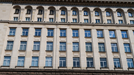 Fototapeta na wymiar Front view window architecture of monumental, communist-era shopping mall in Sofia, Bulgaria