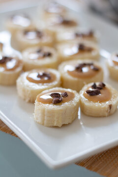 Fast homemade snack: banana canape with cacao nibs, Peanut butter and coffee. Delicious, healthy food