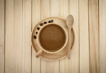 Espresso coffee in a wooden cup (top view) with bread, coffee beans Placed on a wooden...
