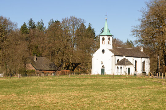 Picturesque white plastered church in the Veluwe village of Hoenderloo.