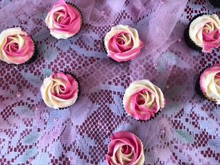 Decorative rose cup cakes on the table 