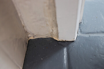 close up of tile flooring and architrave with old worn out materials in need to be fixed, diy and...