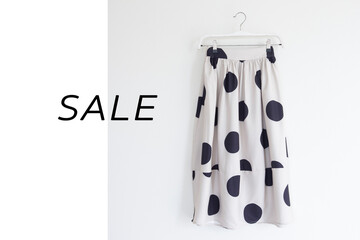 Polka dot Skirt is on clothes-hanger on white background.close up.for sale