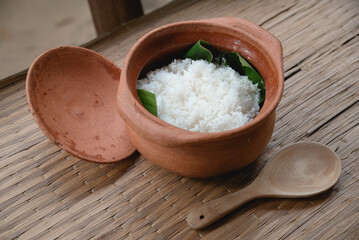 Steamed rice in clay cooking pot as traditional rice in Thailand 