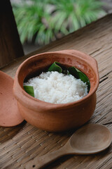 Steamed rice in clay cooking pot as traditional rice in Thailand 