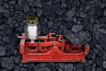Graveyard candle and coal on the weight as concept after the fatal accident - obrazy, fototapety, plakaty
