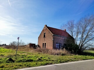Fototapeta na wymiar Abandoned house in Belgium in the countryside. Black and white photo.