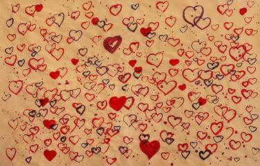 red hand painted hearts on crinkled wavy wrapping paper as valentines day background decoration